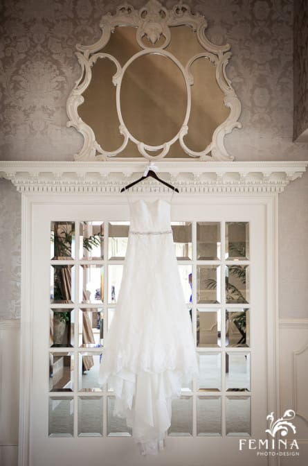 wedding dress hanging in bridal suite