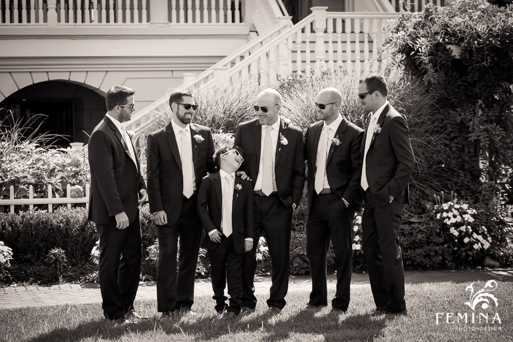 candid groomsmen photo with sunglasses on