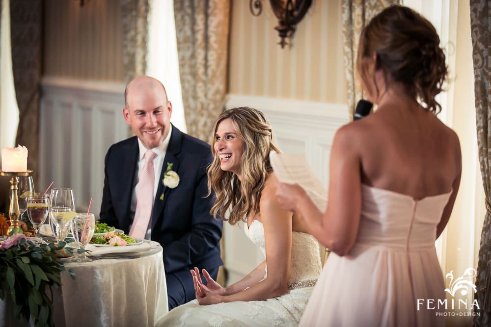 groom and bride laughing during speeches