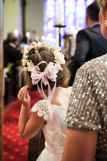 flower girl watching bride come down the aisle