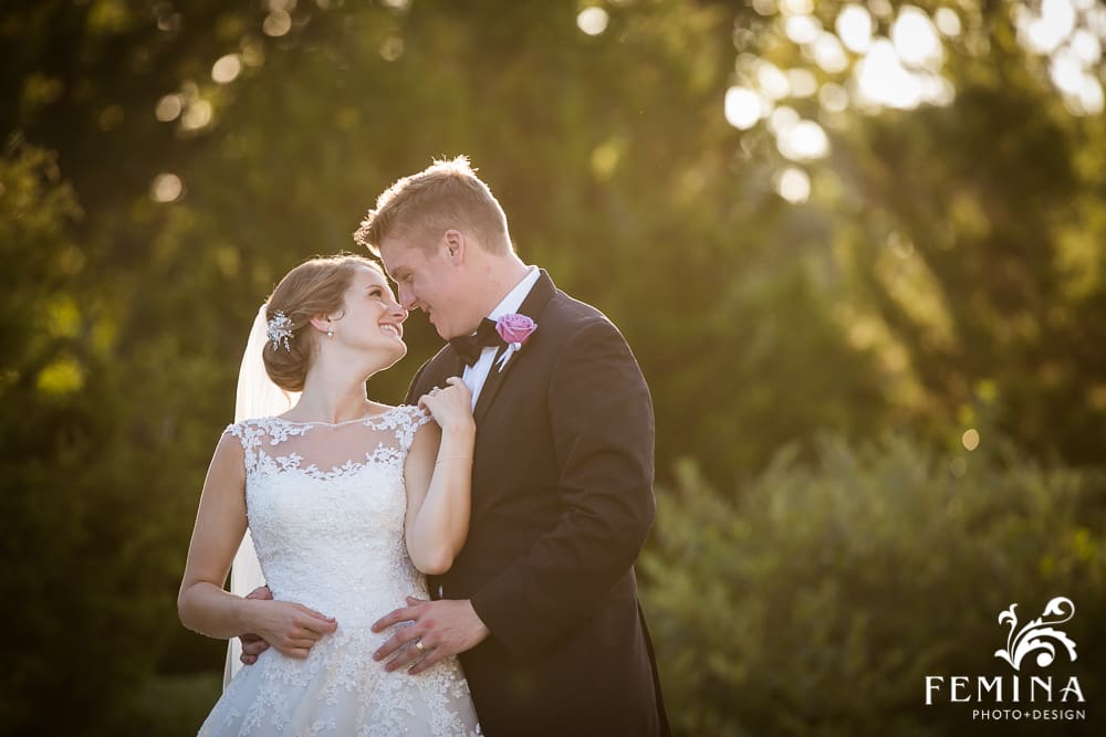 bride and groom pose during golden hour
