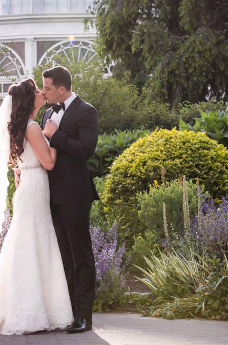 Christina and Ryan kissing in the gardens during their NYBG wedding