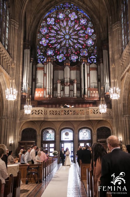 Christina and her dad walk down the aisle at Church of the Blessed Sacrament in NYC
