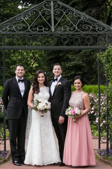 Christina and Ryan pose with their bridal party in the garden at their NYBG wedding