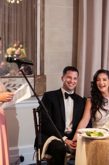 Christina and Ryan laughing during the maid of honor speech at their NYBG wedding