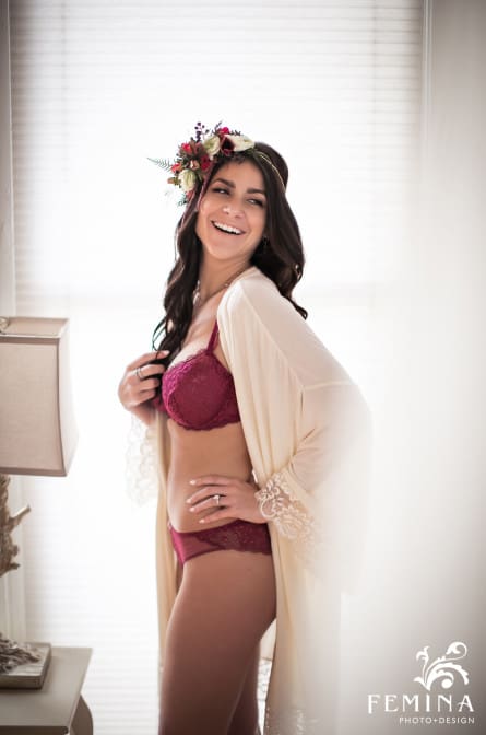 Model Ashley laughing during a boudoir shoot by Philadelphia Boudoir Photographer