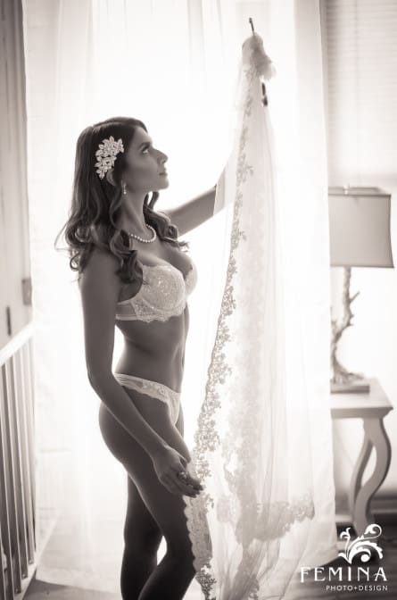 Eva posing for a photo with her bridal lingerie during a boudoir shoot by Philadelphia Boudoir Photographer