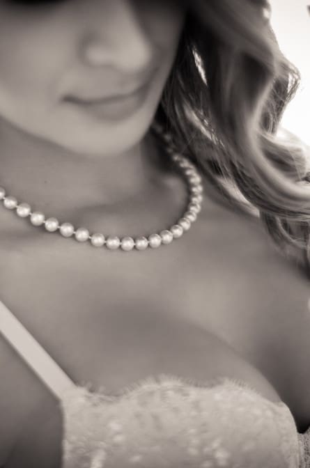 Close up detail on Harry Merril jeweler's pearl necklace during a boudoir shoot by Philadelphia Boudoir Photographer