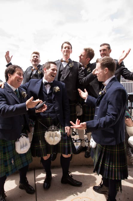 Lyall and his groomsmen on the balcony at the Hyatt at the Bellevue