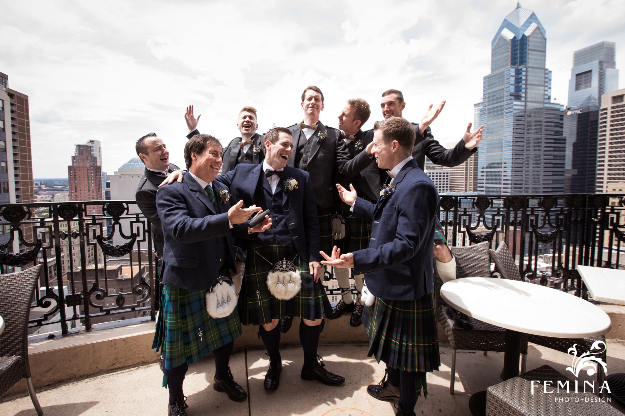 Lyall and his groomsmen on the balcony at the Hyatt at the Bellevue