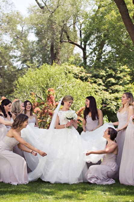 Bridesmaids laughing at Gansett Green manor before wedding beings