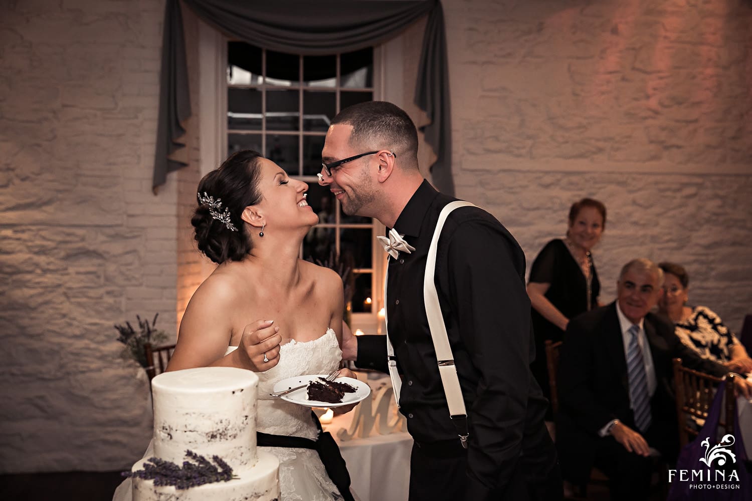 Marijela and Steven feed each other cake at their reception