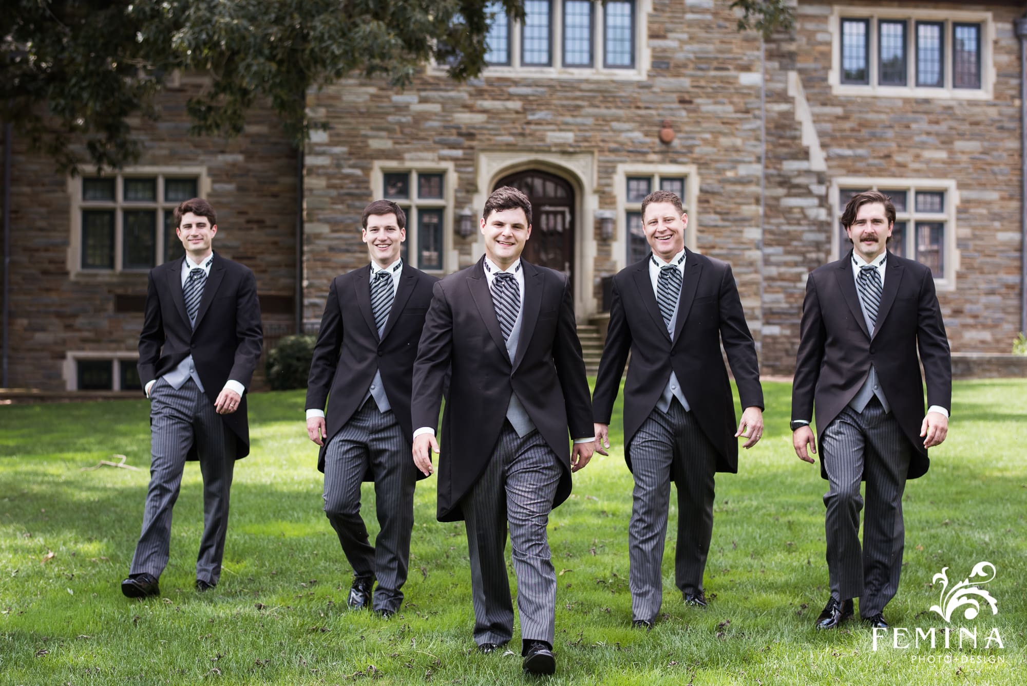 Max and his groomsmen walking on the grounds of Saint Andrews School in Delaware