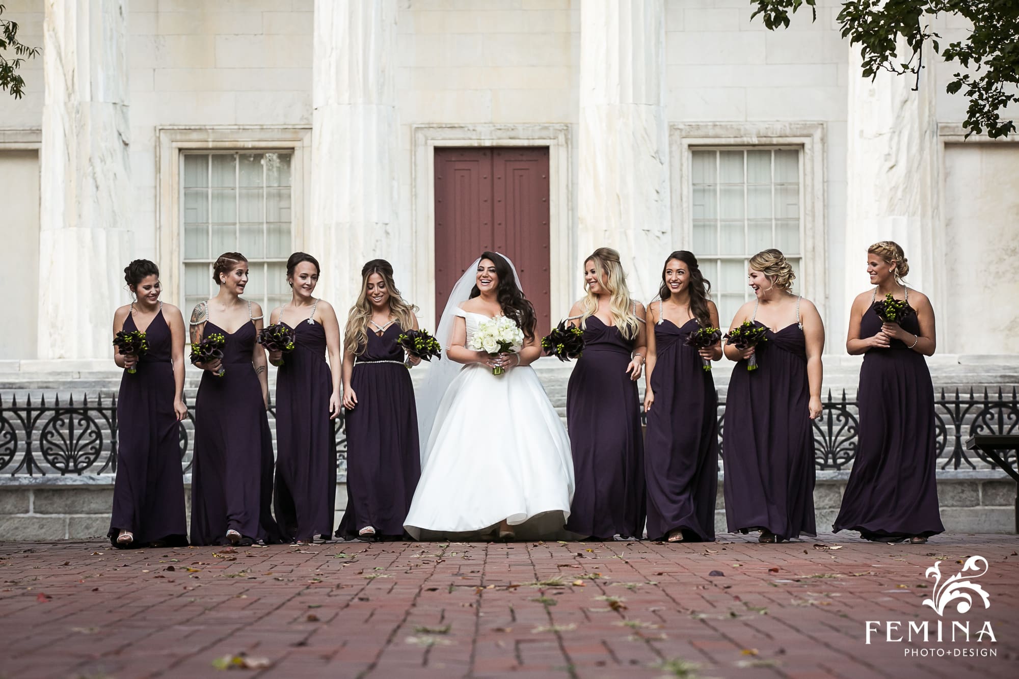 Christina and her bridesmaids walking in front of the 2nd Bank of the U.S. before her wedding at the Bellevue