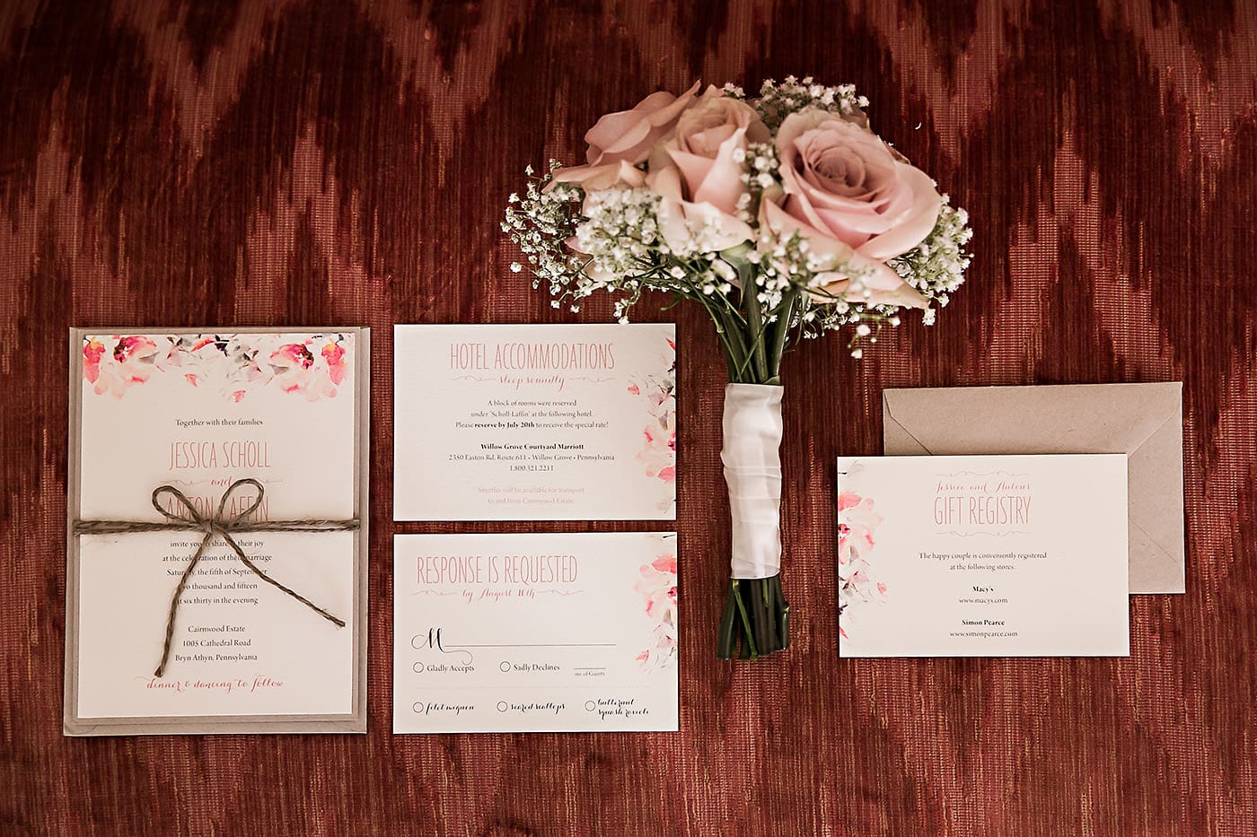 Pretty watercolor floral wedding invitations with twine bow