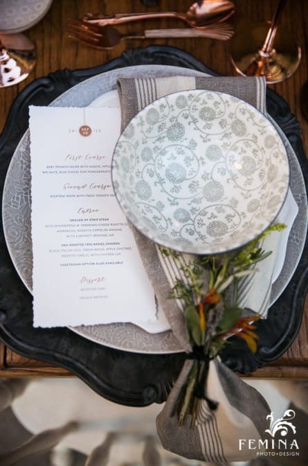 Detail of Brook and Tony's place settings with their invitation