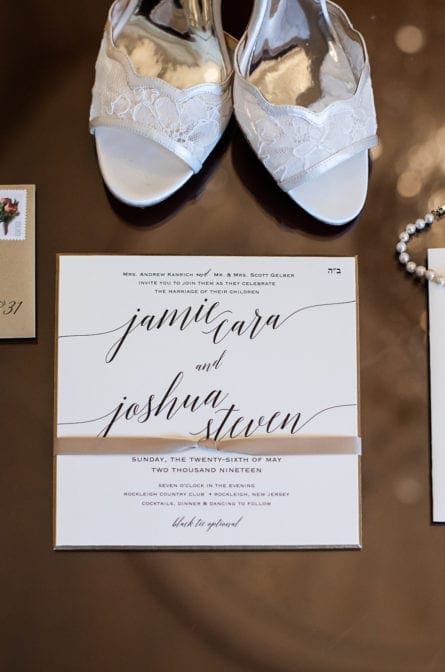 Bridal details such as shoes, invitation suite and jewlery