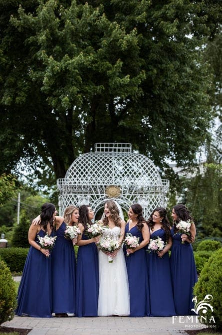 Bride and her bridesmaids posing in front of a gazebo at The Rockleigh