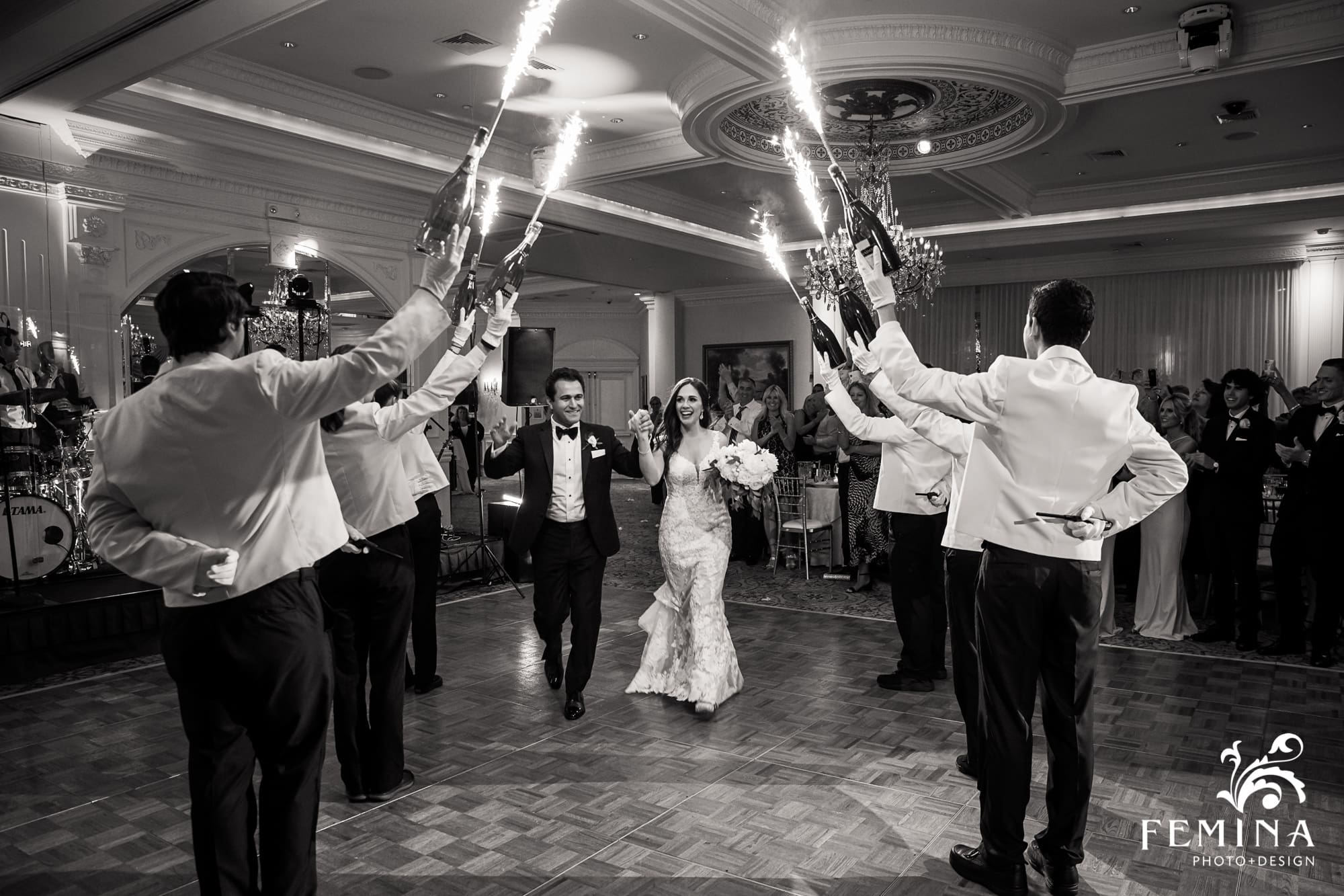 Chelsey and Alex entering their reception with a sparkler entrance at Eagle Oaks Country Club