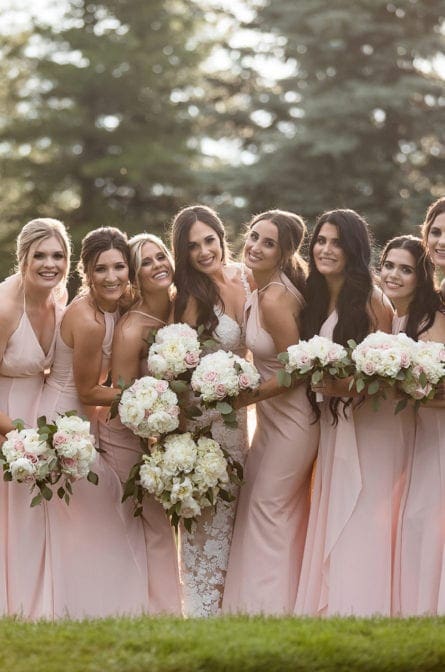 Bridesmaids posing for photographs at Eagle Oaks Country Club in New Jersey