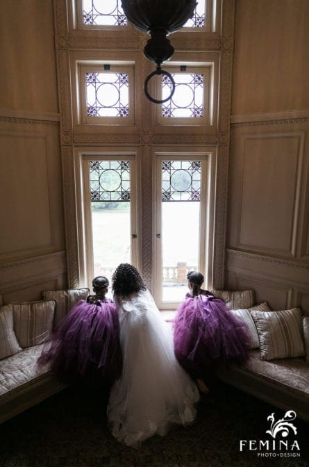 Flower girls looking out the window at Cairnwood Estate
