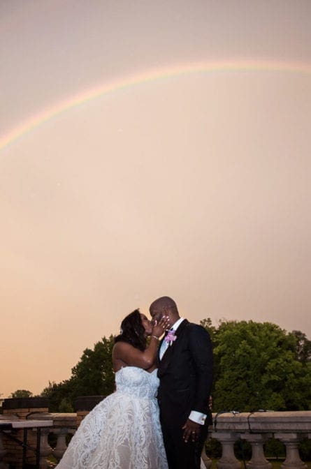 Couple in front of a double rainbow at Cairnwood Estate