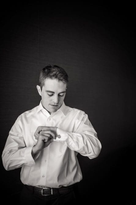 Groom getting ready in black and white