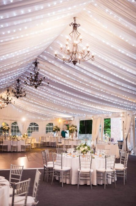 An elegantly decorated tent for a wedding reception at Lyndhurst Castle